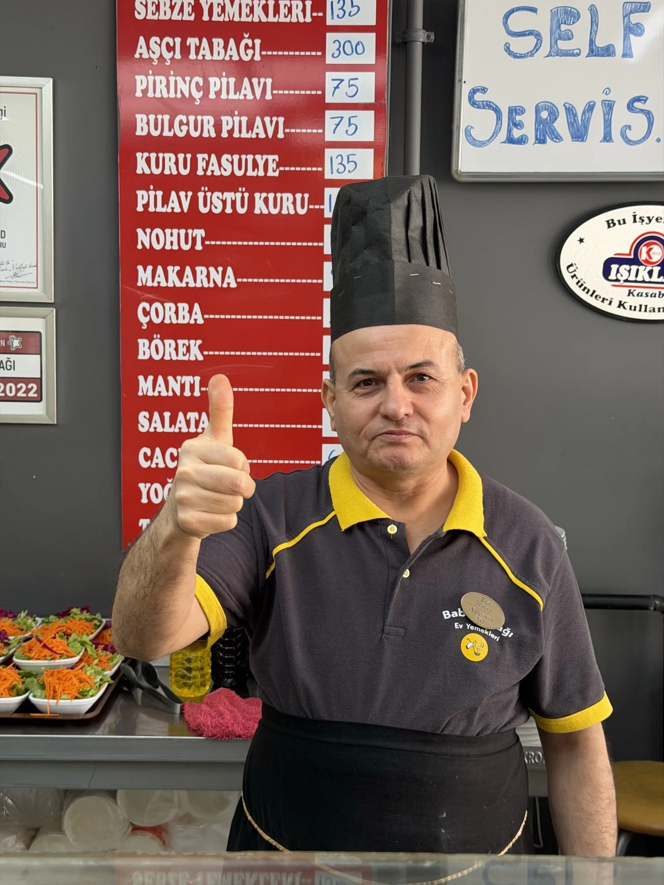 Our cook holding a plate