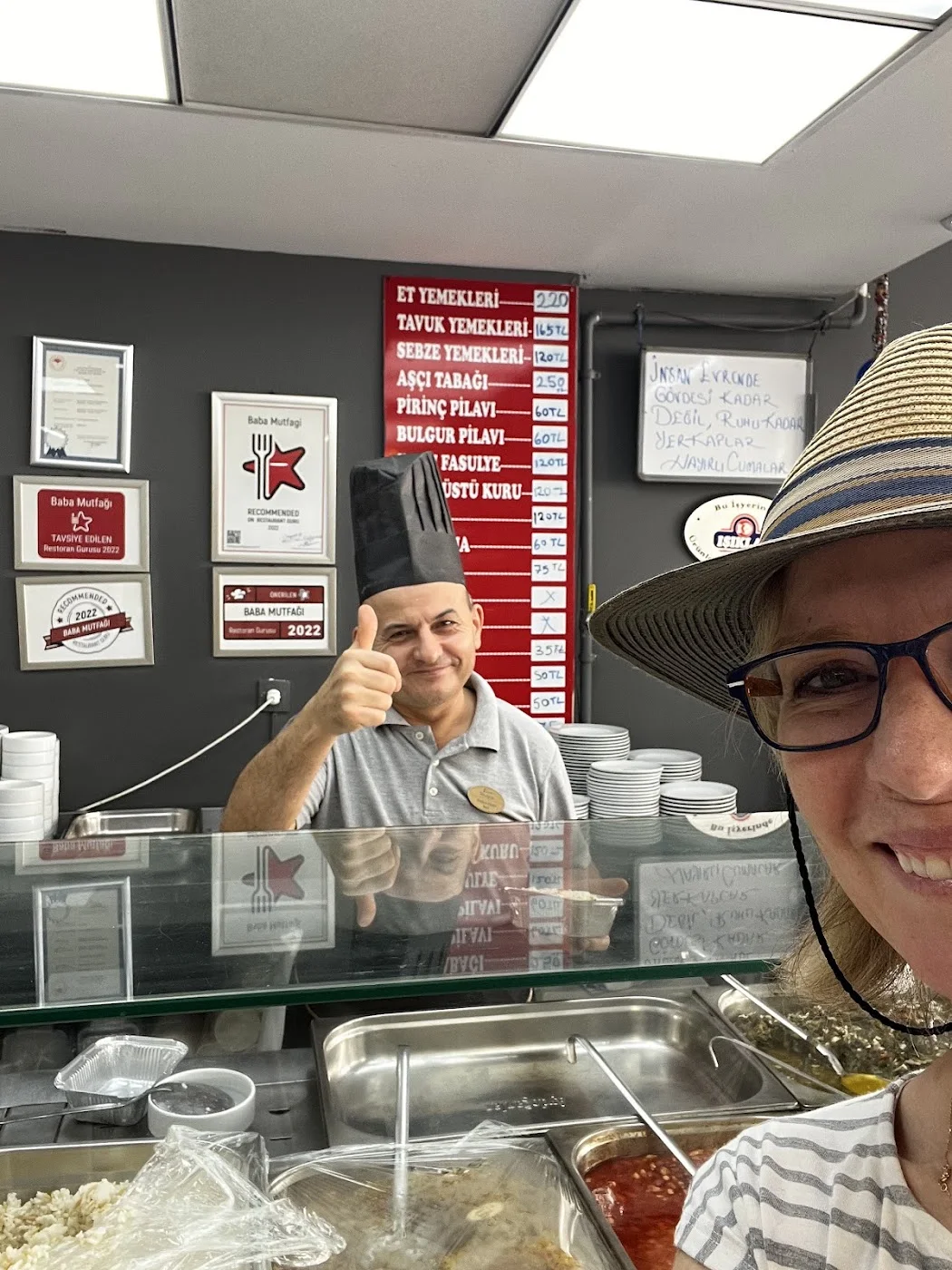 Selfie with the chef giving a thumbs-up
