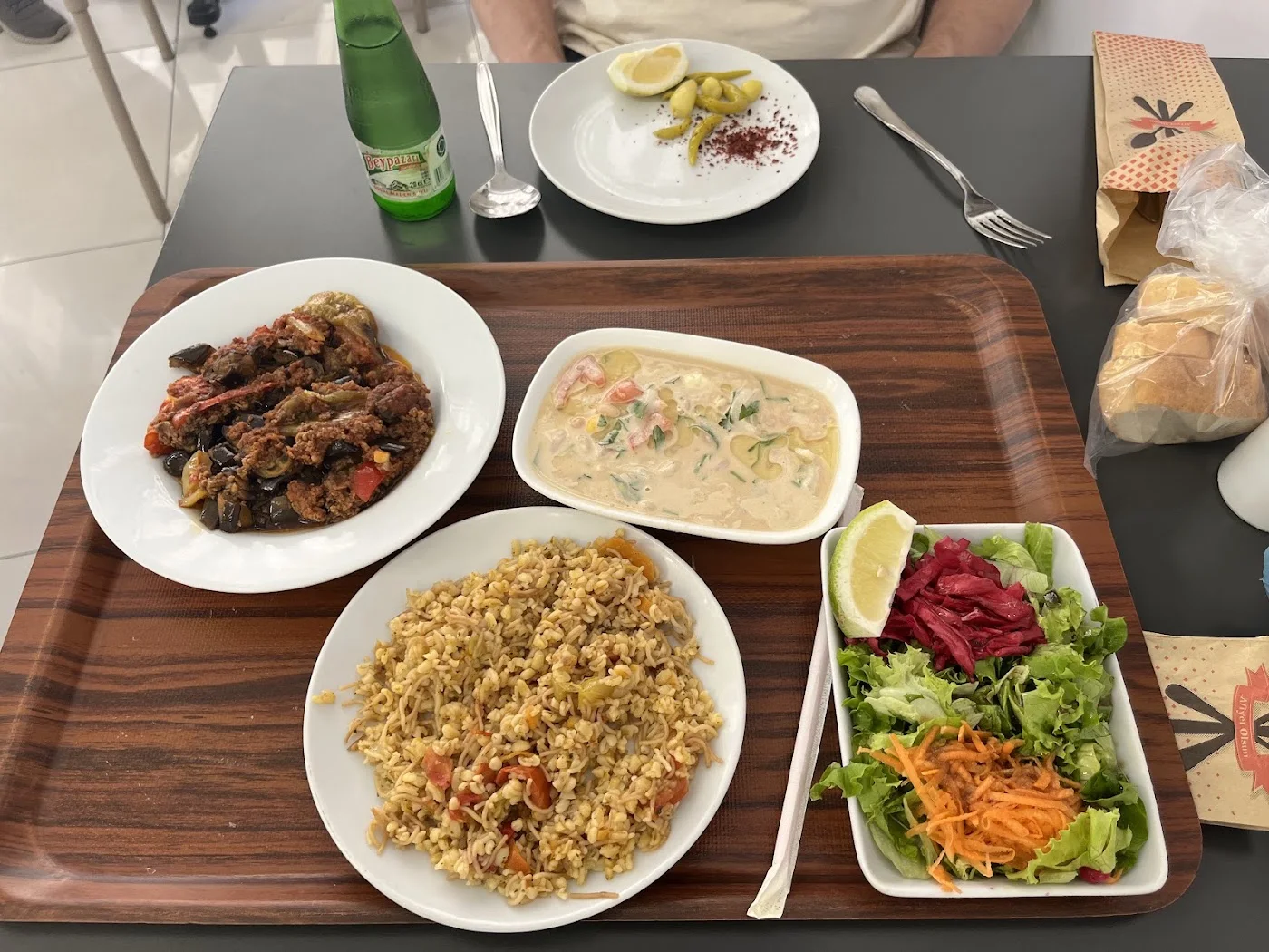 A tray of rice, stew and salad